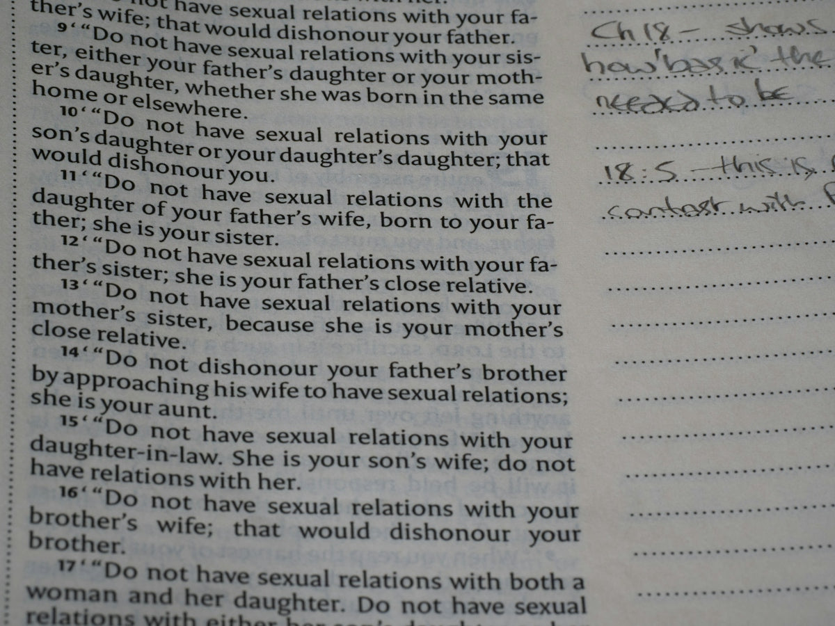 Book page displaying text about relationships and handwritten notes